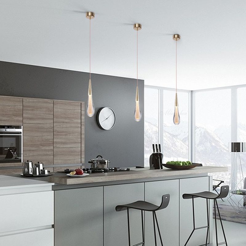 Teardrop Pendant Light With Golden Accent And Warm Glow