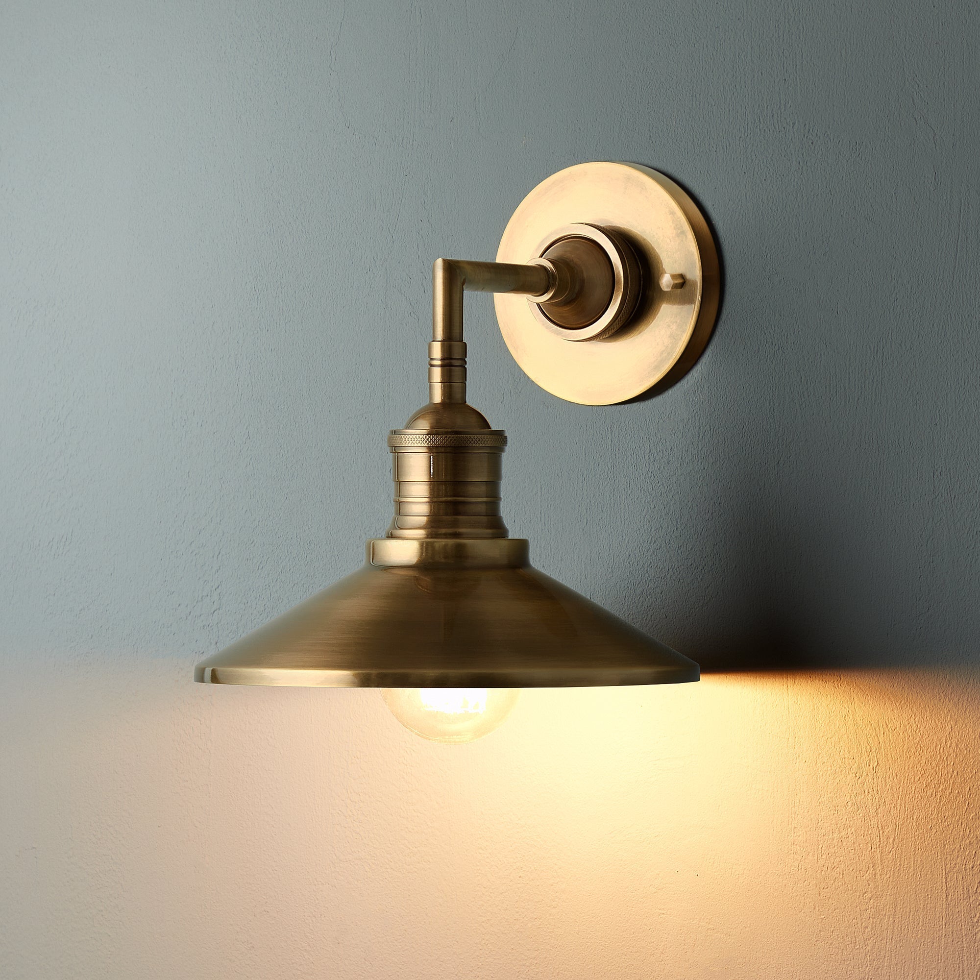 Antique Brass Wall Lamp With Exposed Bulb And Conical Shade