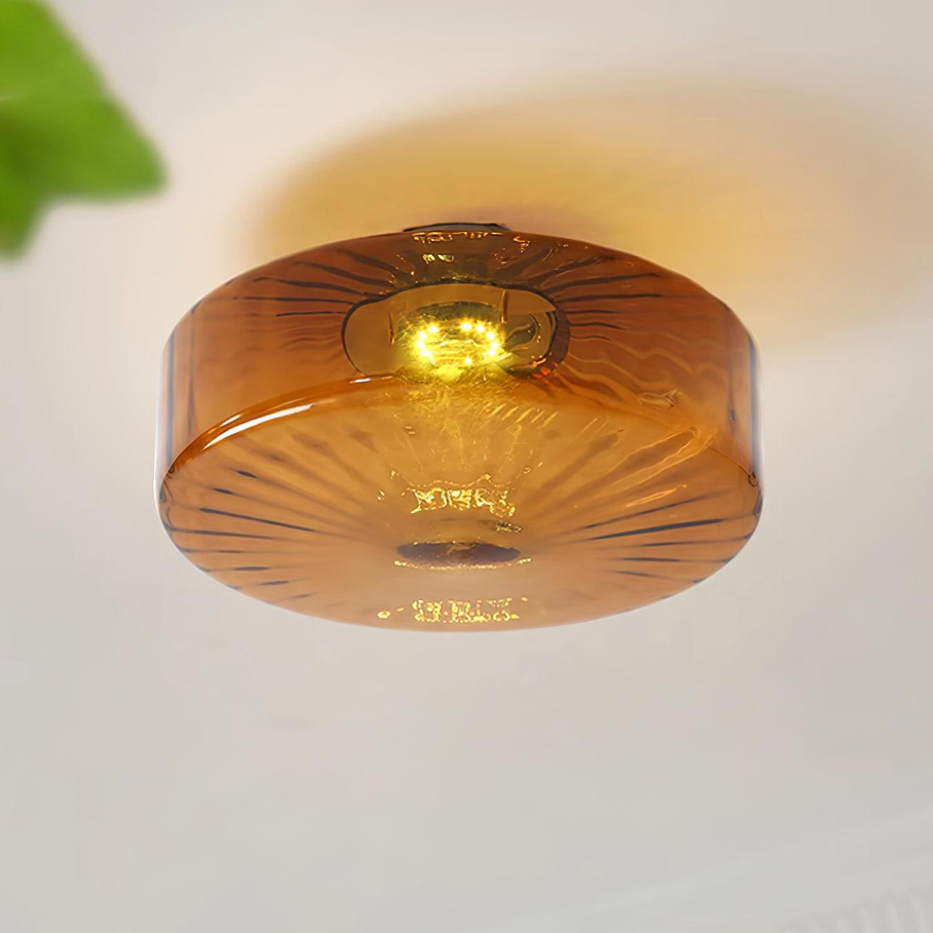 Amber Glass Ceiling Light With Sunburst Pattern And Warm Glow