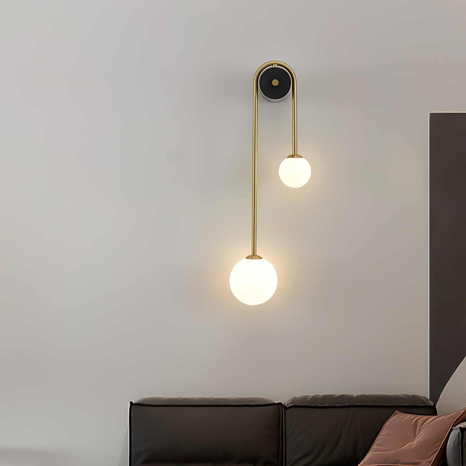 Brass Arc Wall Light With Dual White Glass Globes